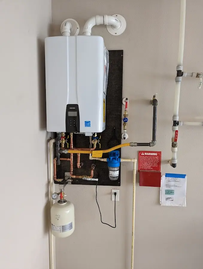 Professional plumber installing copper piping in a Lake Arrowhead home